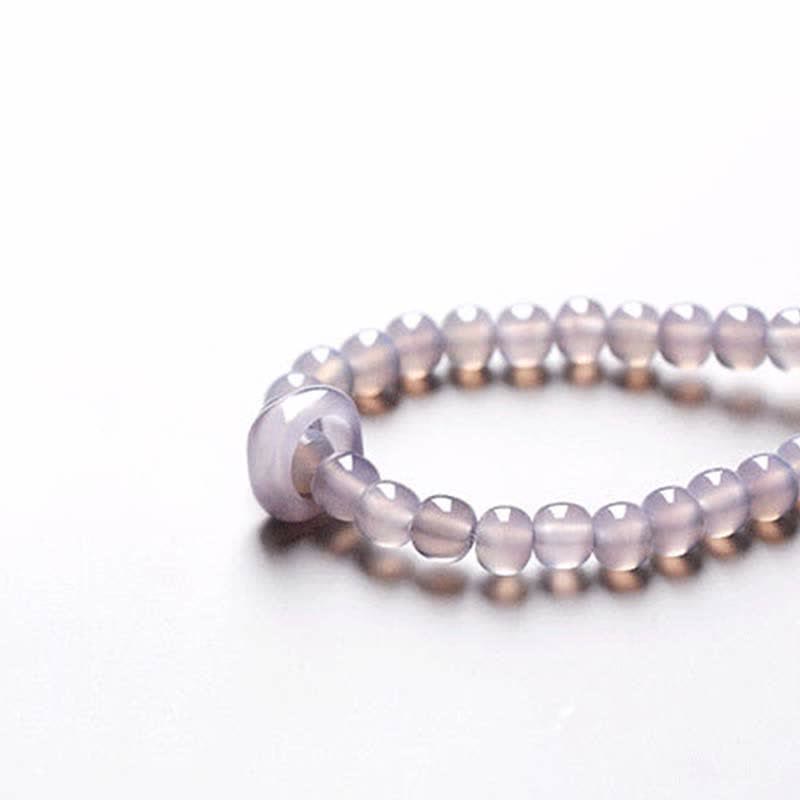 Armband Amethyst Kristall violett Perlen elastisch Handgelenk getragen Heilstein