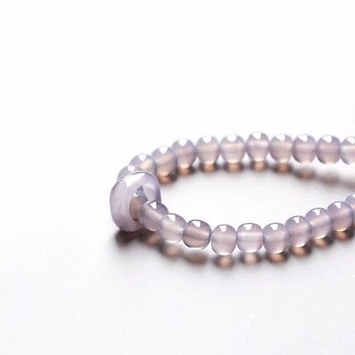 Armband Amethyst Kristall violett Perlen elastisch Handgelenk getragen Heilstein