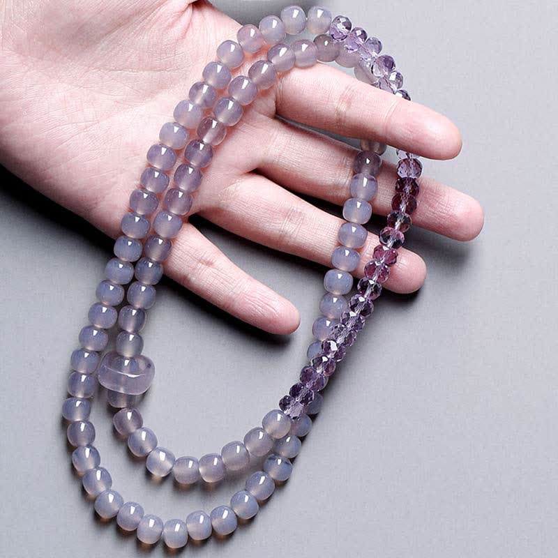Armband Amethyst Kristall Heilung Stärke violett Naturstein elastisch Handgelenk getragen