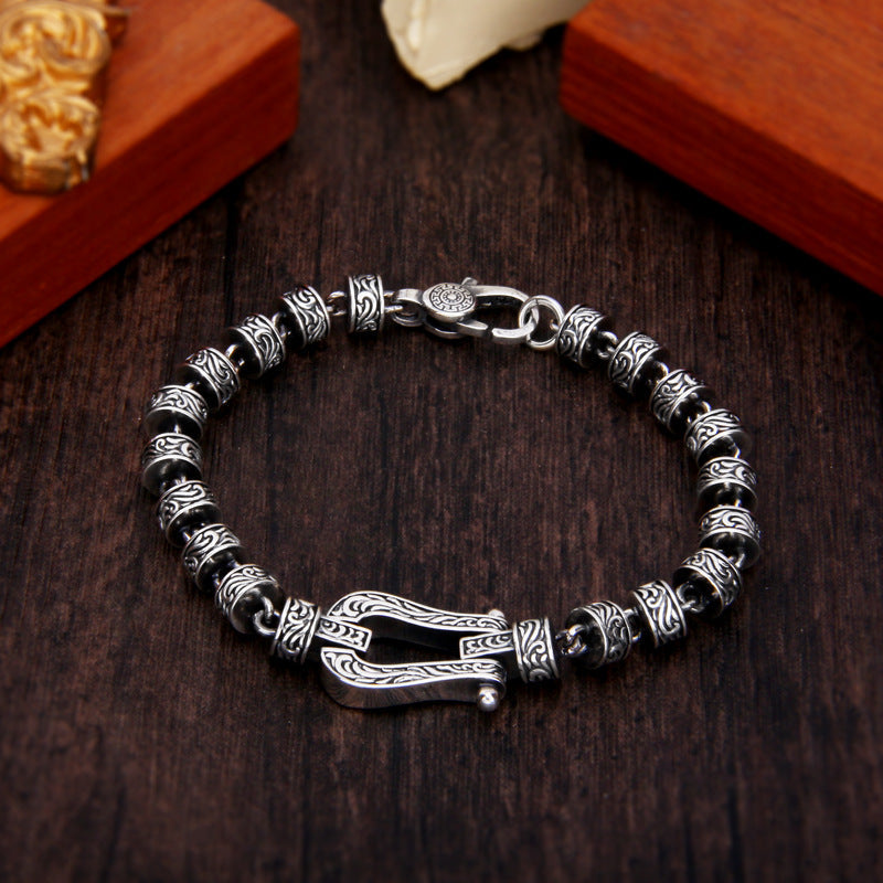 Silbernes Armband Tang Dynastie Glück mit ornamentalen Perlen Verschluss.