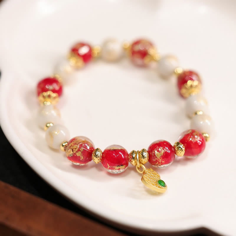 Armband Kürbis Wohlstand Glück Energie rote Perlen Gold Charm elegant