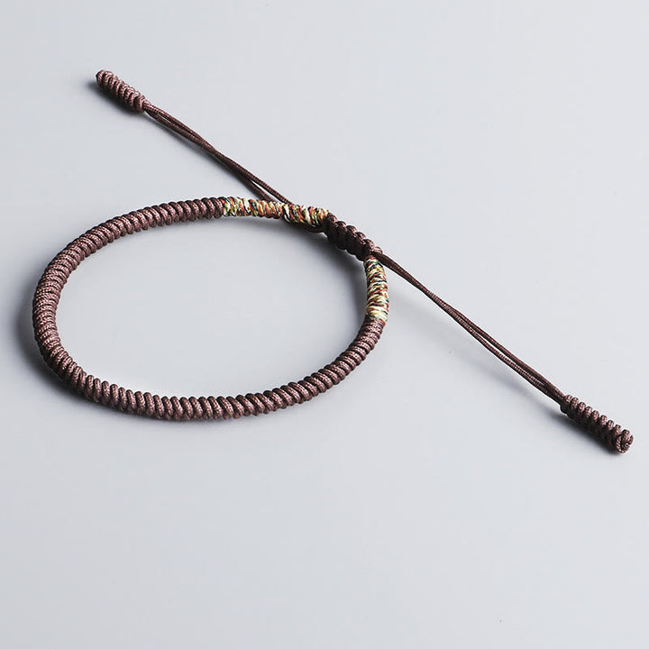 Tibetisches Armband braun gewickelt Glücksbringer Handwerk traditionell