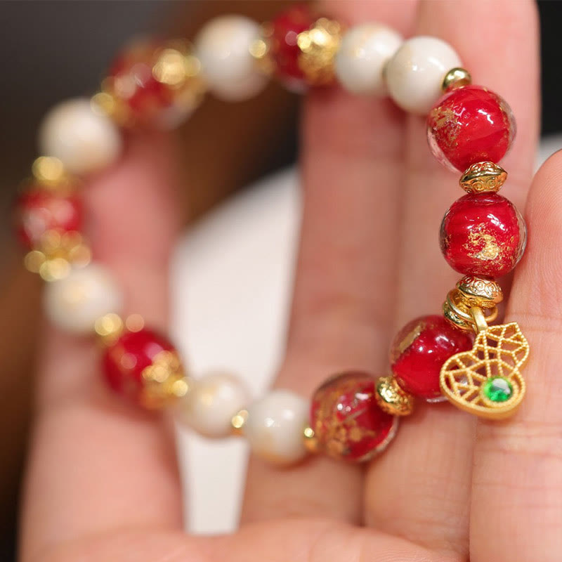 Armband Kürbis Wohlstand Glück Energie rote weiße Perlen Gold elegant