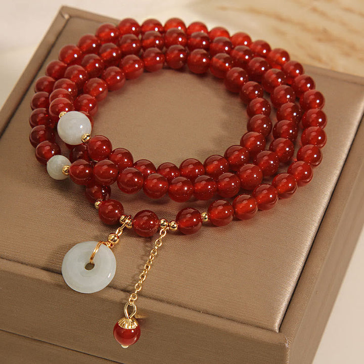 Armband Roter Achat Jade mit weißen Steinen Gold Perlen elastisch