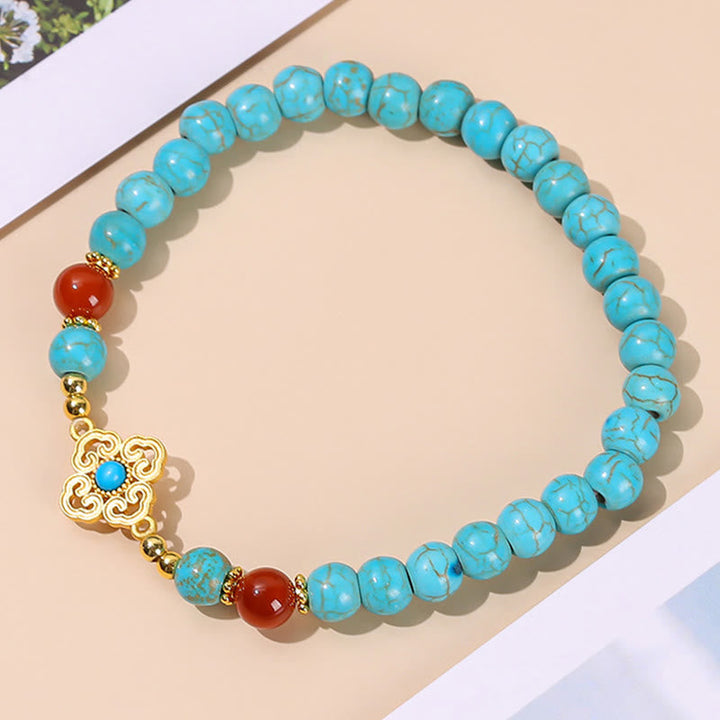 Armband Türkis – Schutz & Balance mit goldenem Blütenanhänger elastisch