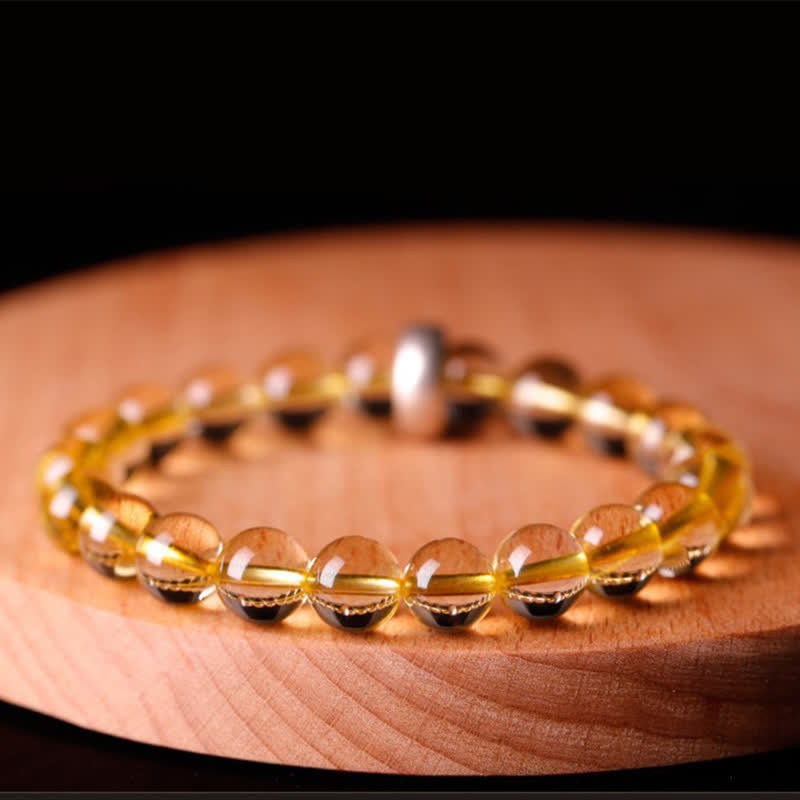 Citrin Armband mit Silber Spacer auf Holzoberfläche elegant präsentiert