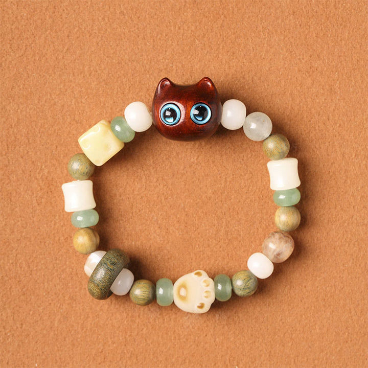 Armband Sandelholz Bodhi Katze mit grünen Steinen Perlen elastisch