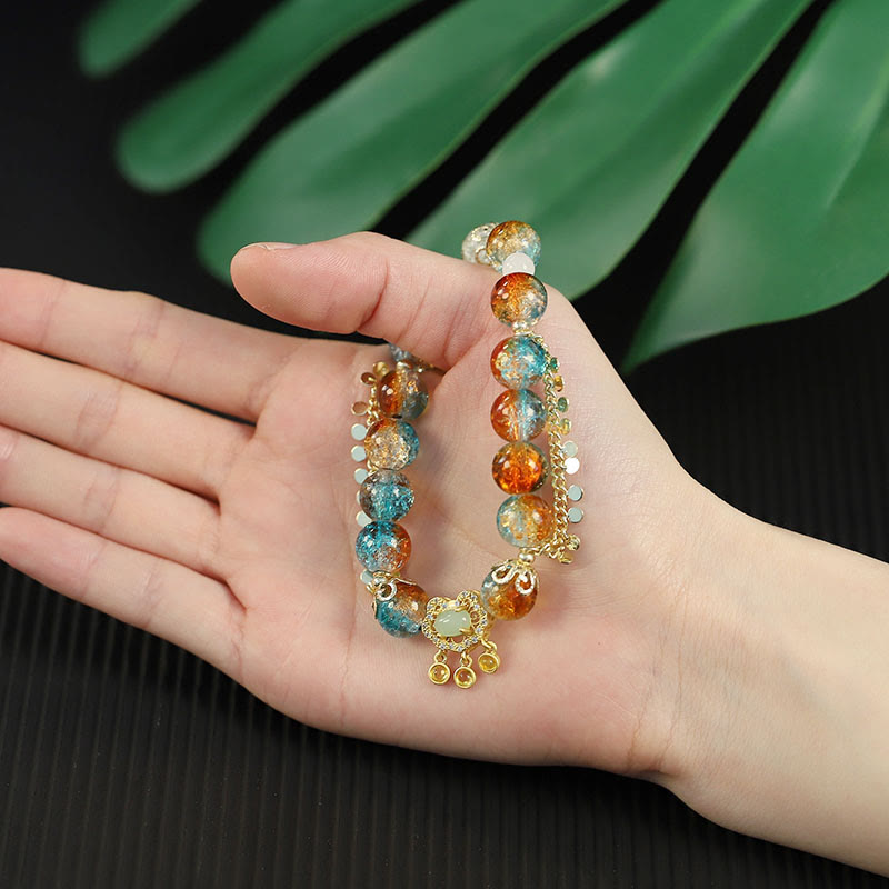 Armband Bunt Liuli Glas Perle Chinesisch mit goldenen Verzierungen am Handgelenk