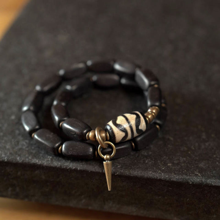 Armband Kupfer Ebenholz mit Zebra-Muster und Spike-Anhänger elegant