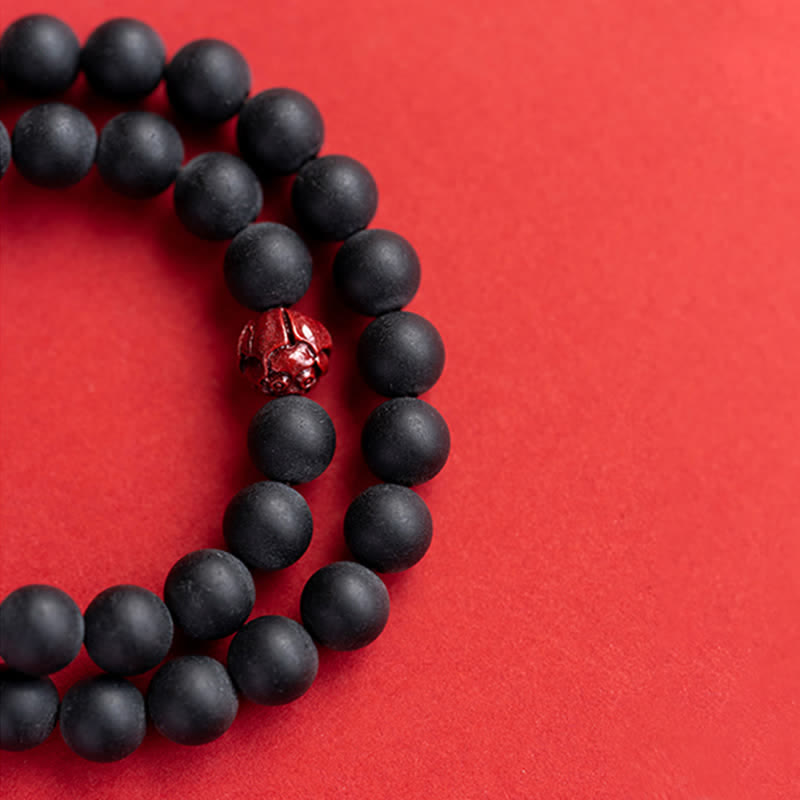 Armband Zinnober Lotus – Heilung schwarze Perlen rote Zinnober Perle