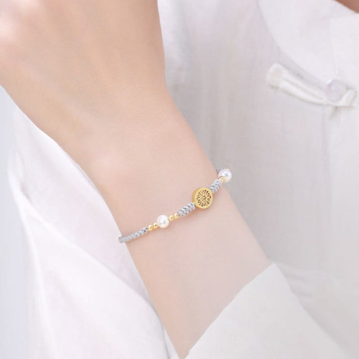Armband Kupfer Perle – Glück mit grauem Perlenarmband elegant getragen