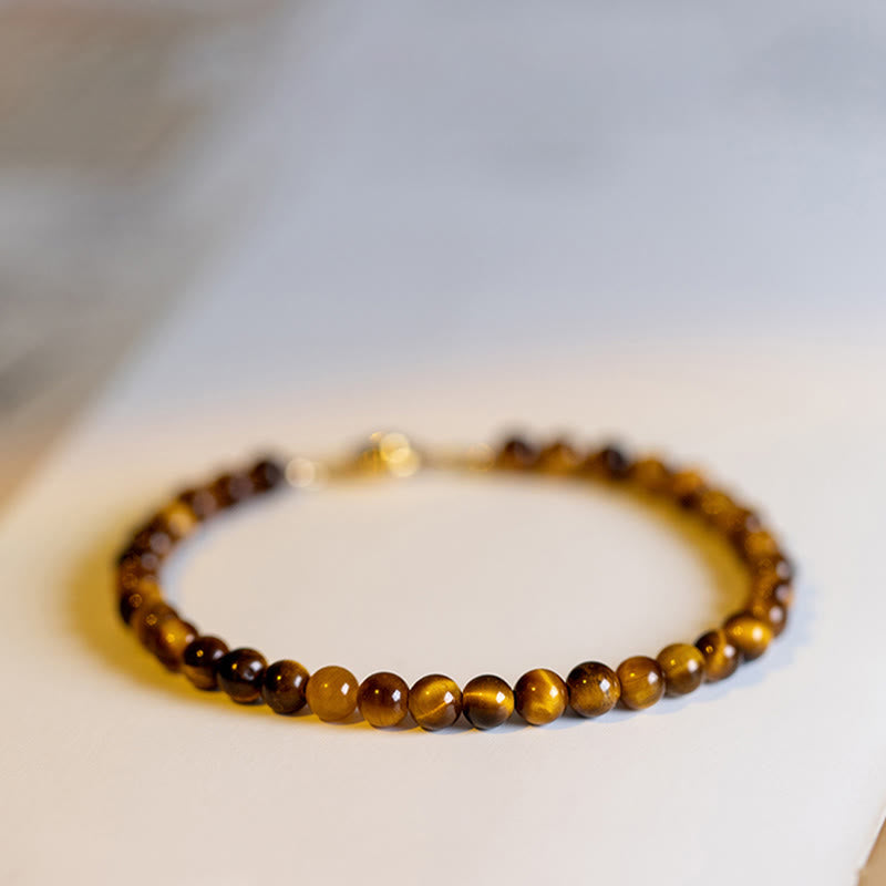 Armband Tigerauge – Schutz & Mut braune Perlen Nahaufnahme Flat Lay