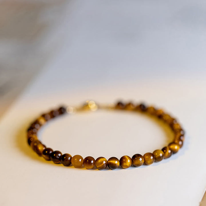 Armband Tigerauge – Schutz & Mut braune Perlen Nahaufnahme Flat Lay