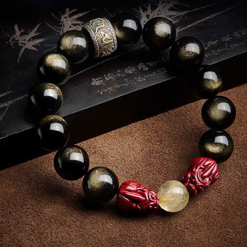 Armband mit schwarzem Obsidian und roten Zinnober-Perlen elegante Kombination.