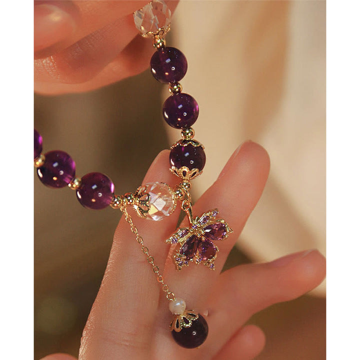 Armband Amethyst – Heilung & Energie mit lila Steinen und goldenen Elementen