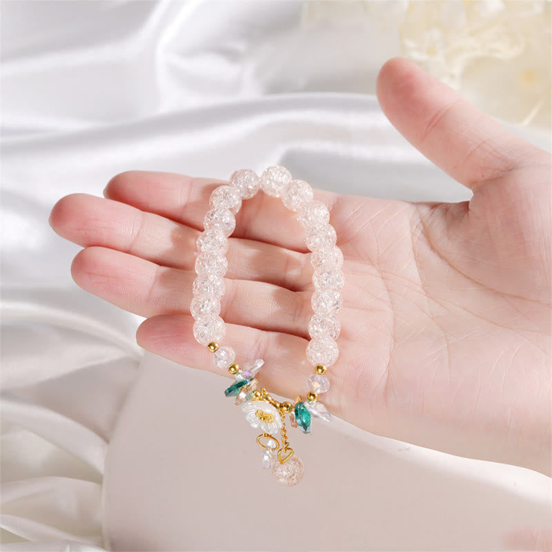 Armband Blume Glas mit Perlen und Blütenanhängern elegantes Design.
