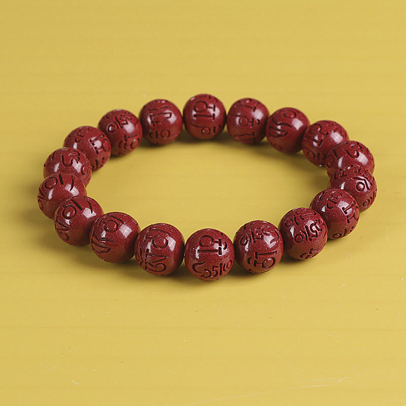 Zinnober Armband mit Om Mani Padme Hum Gravur rotes Perlenarmband elastisch