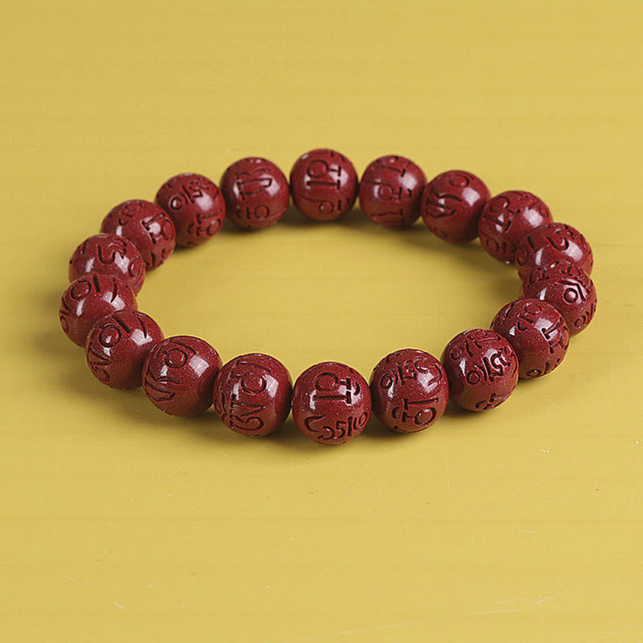 Zinnober Armband mit Om Mani Padme Hum Gravur rotes Perlenarmband elastisch