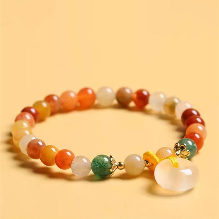 Armband Jade – Wohlstand & Frieden mit Orangencalcit und Mondstein.