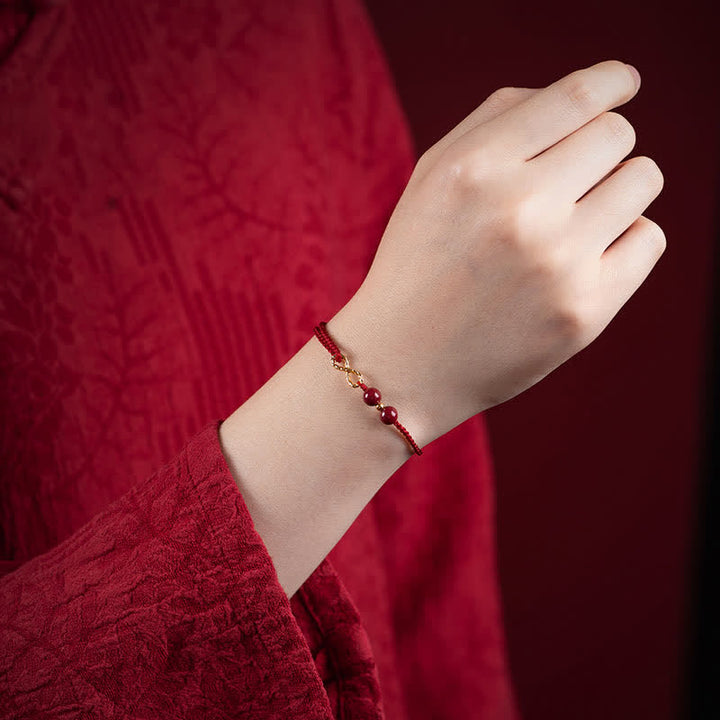 Armband Rotes Band Gold Infinity Symbol