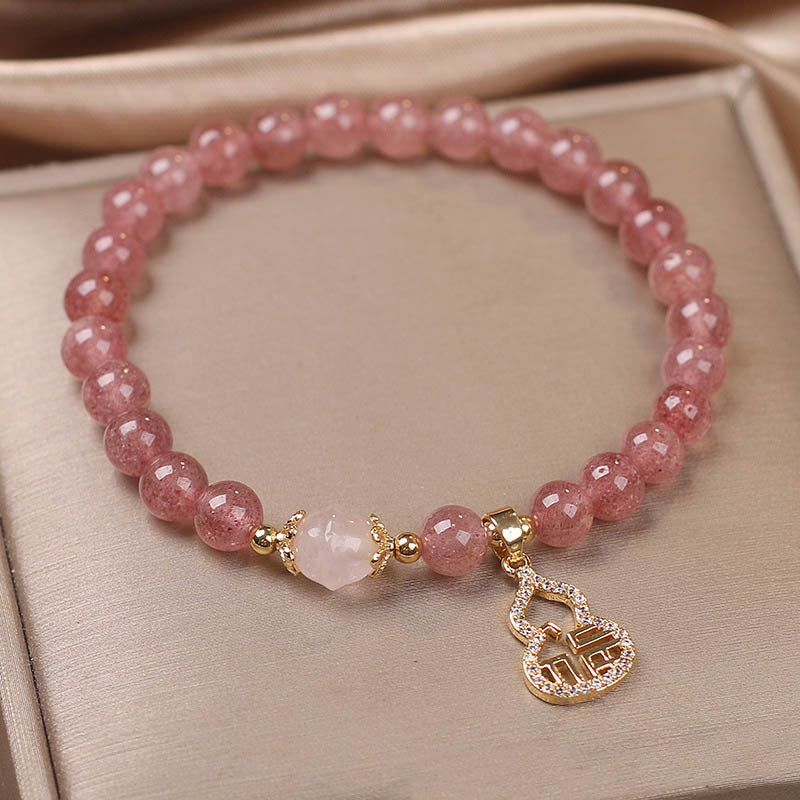Armband Erdbeerquarz Fu-Zeichen rosa Perlen Naturstein elegantes Design.
