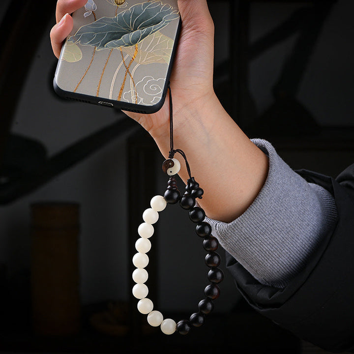 Armband Ebenholz – Schutz zweifarbig Perlen Handgelenk getragen elegant