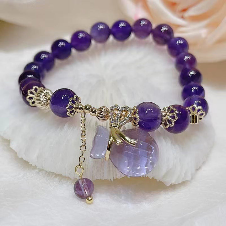 Armband Amethyst Kristall lila Perlen Goldverzierung elegantes Design.