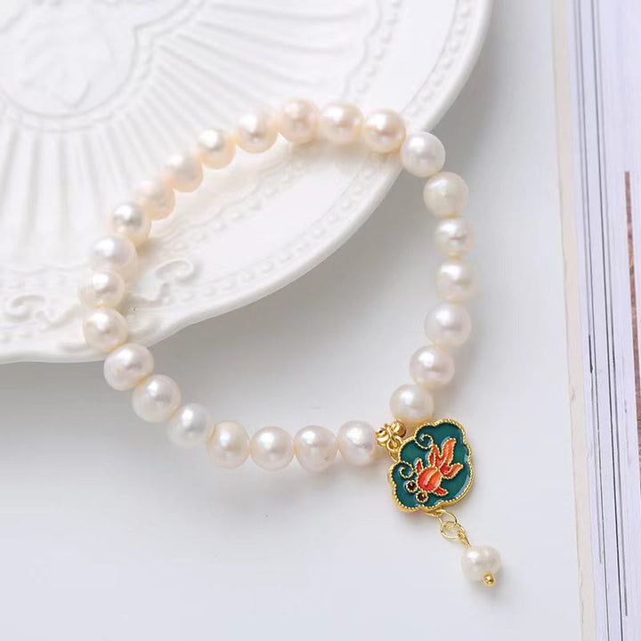 Armband Perle Koi Fisch mit Süßwasserperlen und goldenem Verschluss.