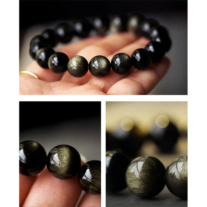 Schwarzes Obsidian Armband mit goldenen Einschlüssen am Handgelenk getragen