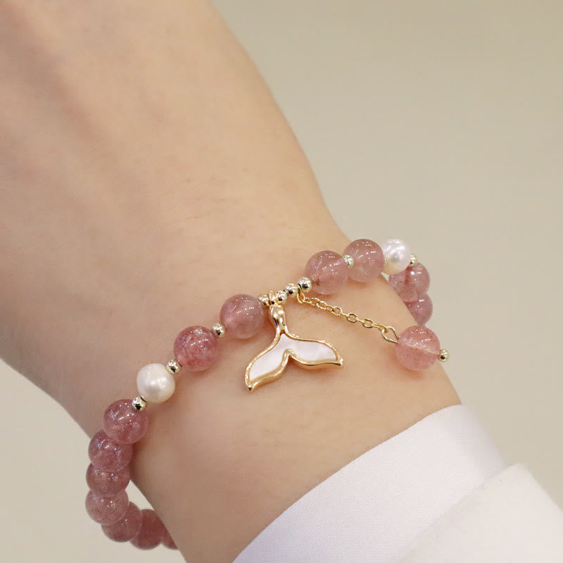 Armband Erdbeerquarz Perle Fu-Zeichen Heilung am Handgelenk getragen rosé