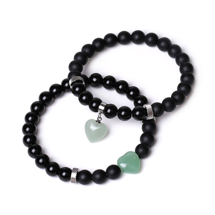 Armband Schwarzer Onyx Kristall Paar elastisch grüne Herzen Anhänger.