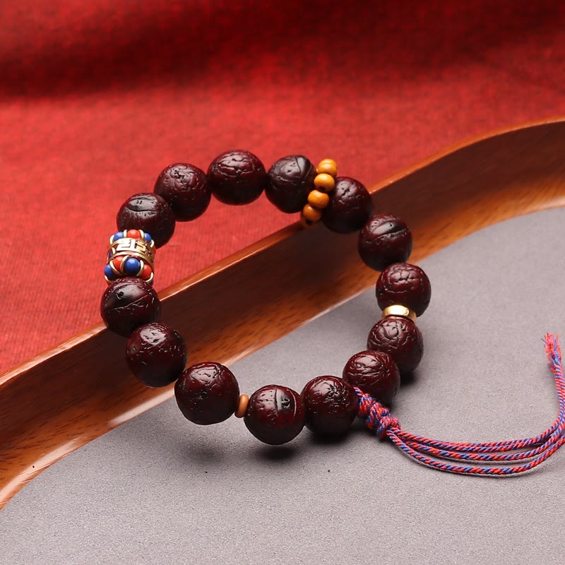 Bodhi Armband Frieden Ruhe dunkelrot Naturstein mit goldenem Schmuckelement