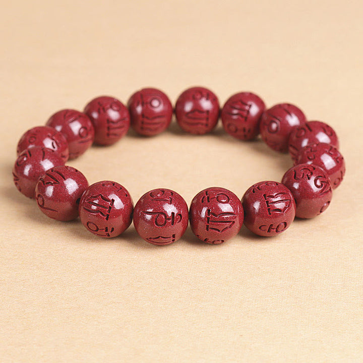 Armband Zinnober Om Mani Padme Hum rote Perlen elastisch Glück Wohlstand
