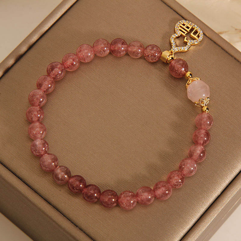 Armband Erdbeerquarz Fu-Zeichen rosafarbene Perlen Naturstein elegant.