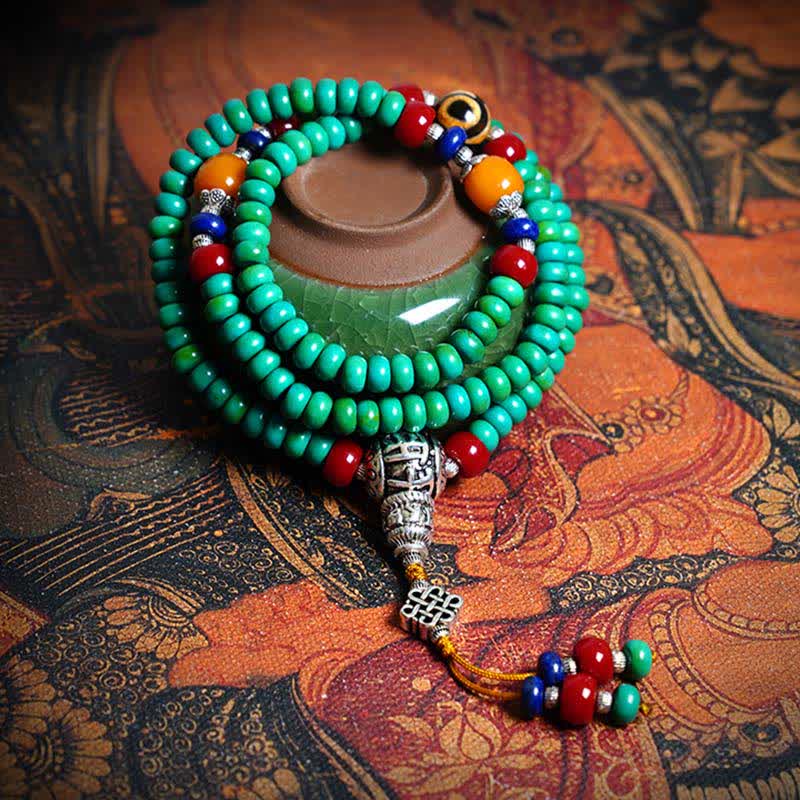 Mala 108 Perlen Türkis Schutz Armband mit silbernen Verzierungen elegant.