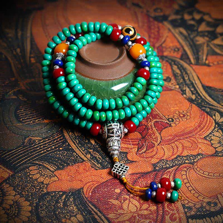 Mala 108 Perlen Türkis Schutz Armband mit silbernen Verzierungen elegant.