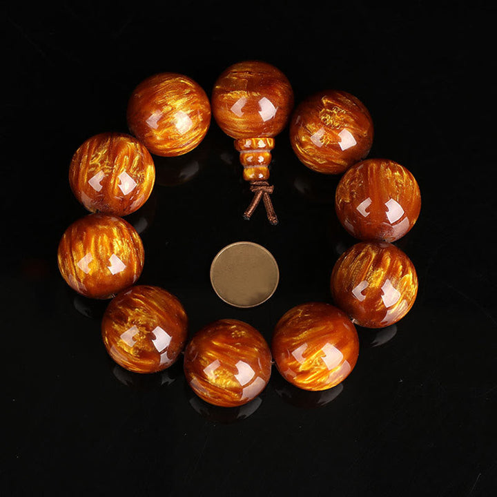 Mala – Erfolg Armband mit glänzenden bernsteinfarbenen Holzperlen Naturstein