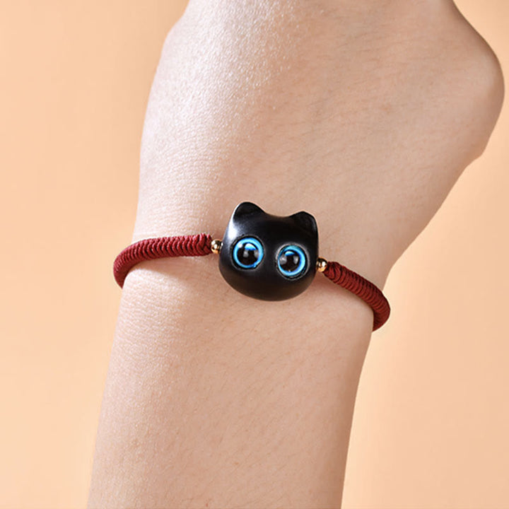 Armband Ebenholz Katze mit blauen Augen elastisch rot