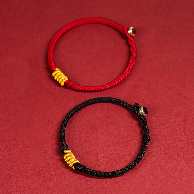 Rotes und schwarzes Armband mit goldenen Perlen Schutzenergie