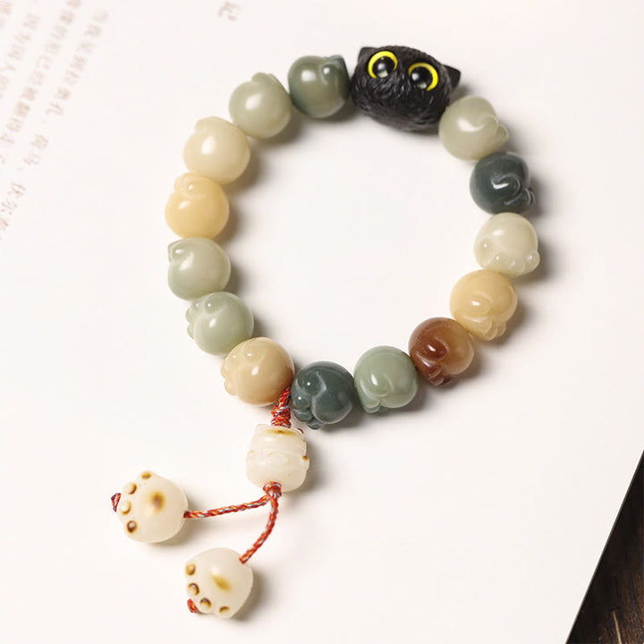 Armband Bodhi Ebenholz Katze mit Glücksperlen elastisch getragen