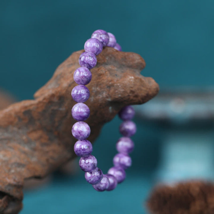 Amethyst Kristall Armband lila Perlen Naturstein elastisch getragen