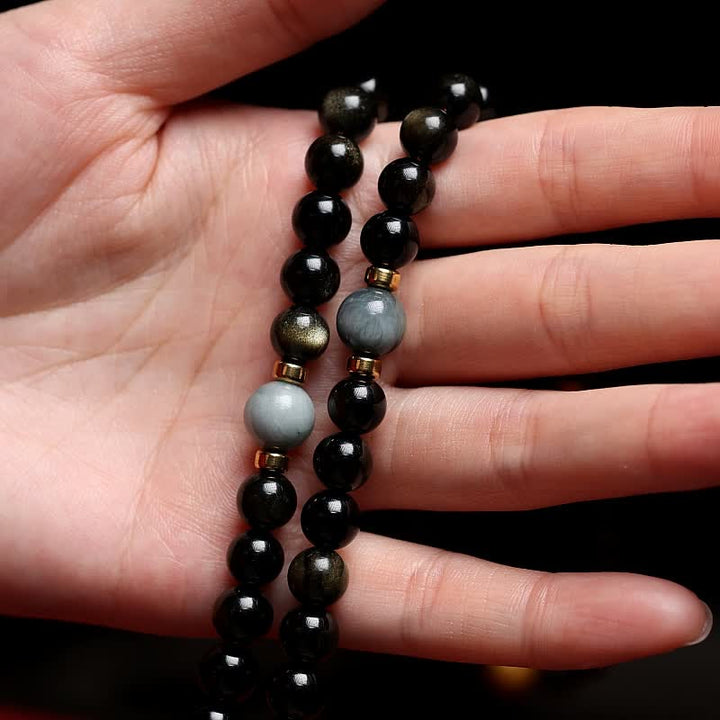 Mala Tigerauge Obsidian Armband am Handgelenk schwarze Perlen Wohlstand