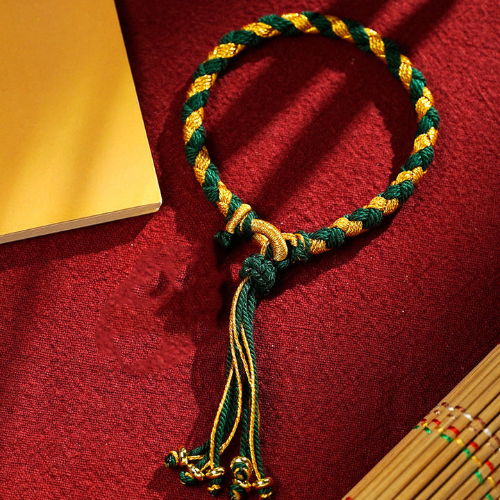 Armband Drachen Glück Wohlstand Energie grün gold geflochten Quaste.