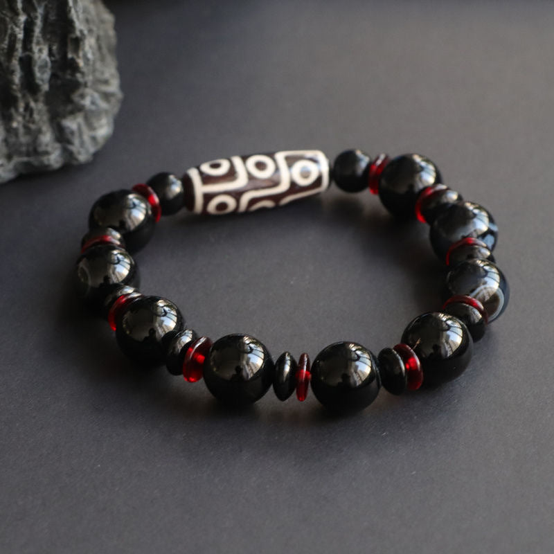 Armband Schwarzer Onyx mit roten Perlen und Tibetischer Perle Schutz