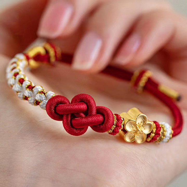 Armband Pfirsichblüte Glück Liebe rotes Seidenknoten Goldperlen Handgelenk