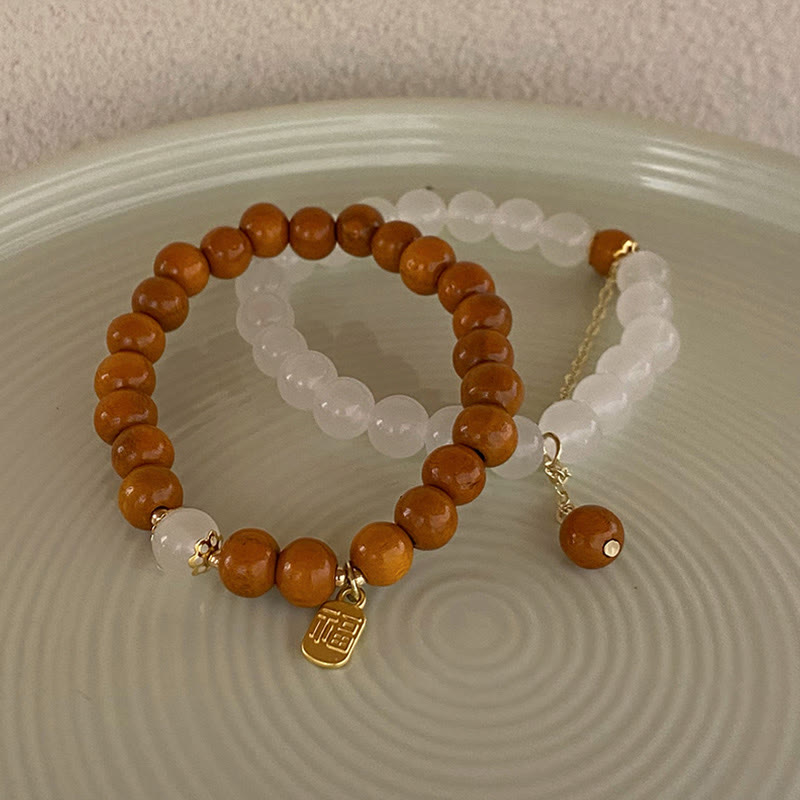 Armband Sandelholz Fu-Zeichen mit weißen Perlen Schutz elegant