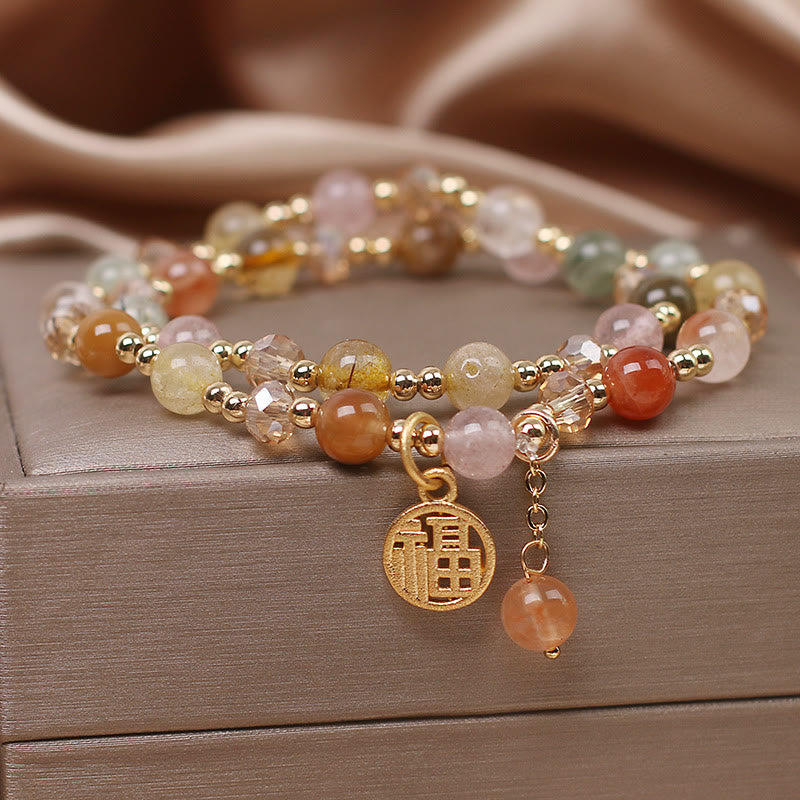 Armband Fu-Zeichen mit Rosenquarz und Citrin Natursteinen golden.