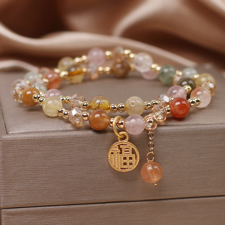 Armband Fu-Zeichen mit Rosenquarz und Citrin Natursteinen golden.