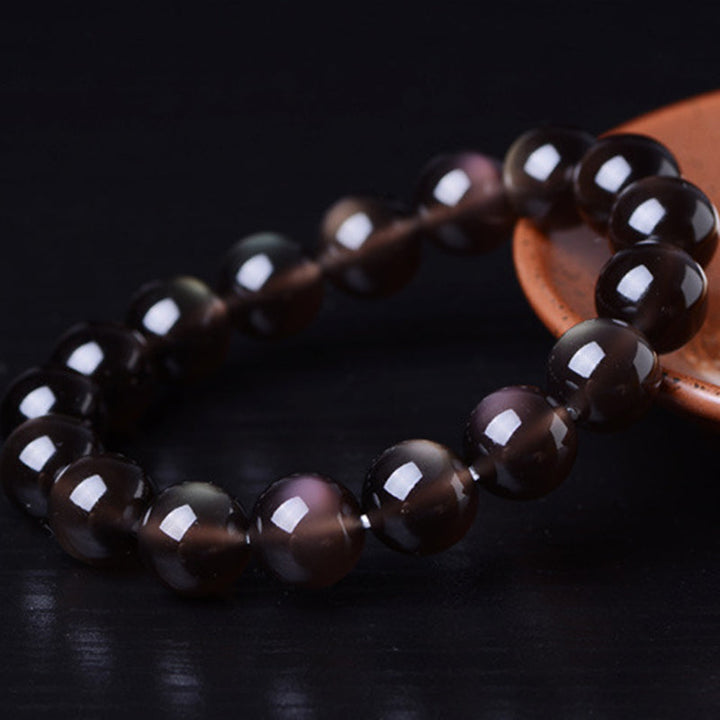 Armband Regenbogen Obsidian – Positivität glänzende schwarze Perlen elastisch getragen