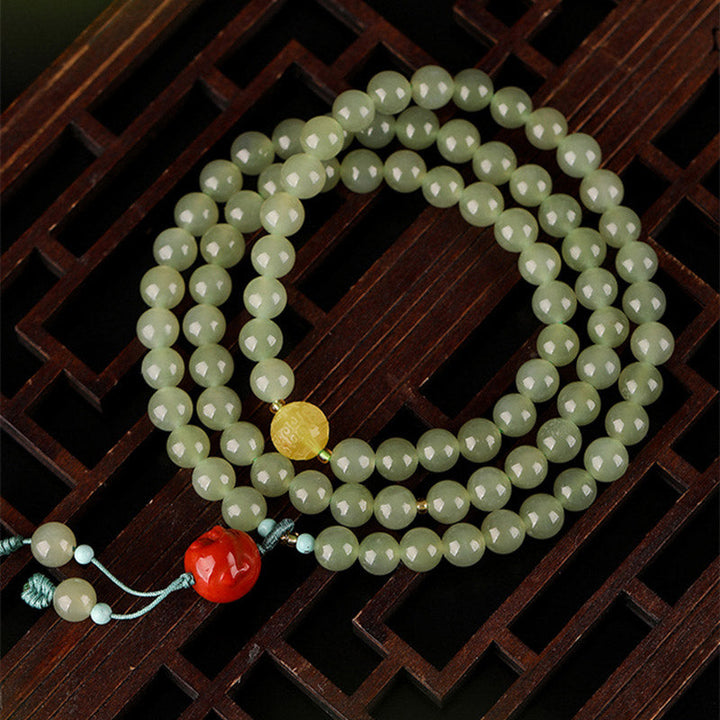 Jade Armband mit roten Achat Perlen und goldenem Buddha Anhänger
